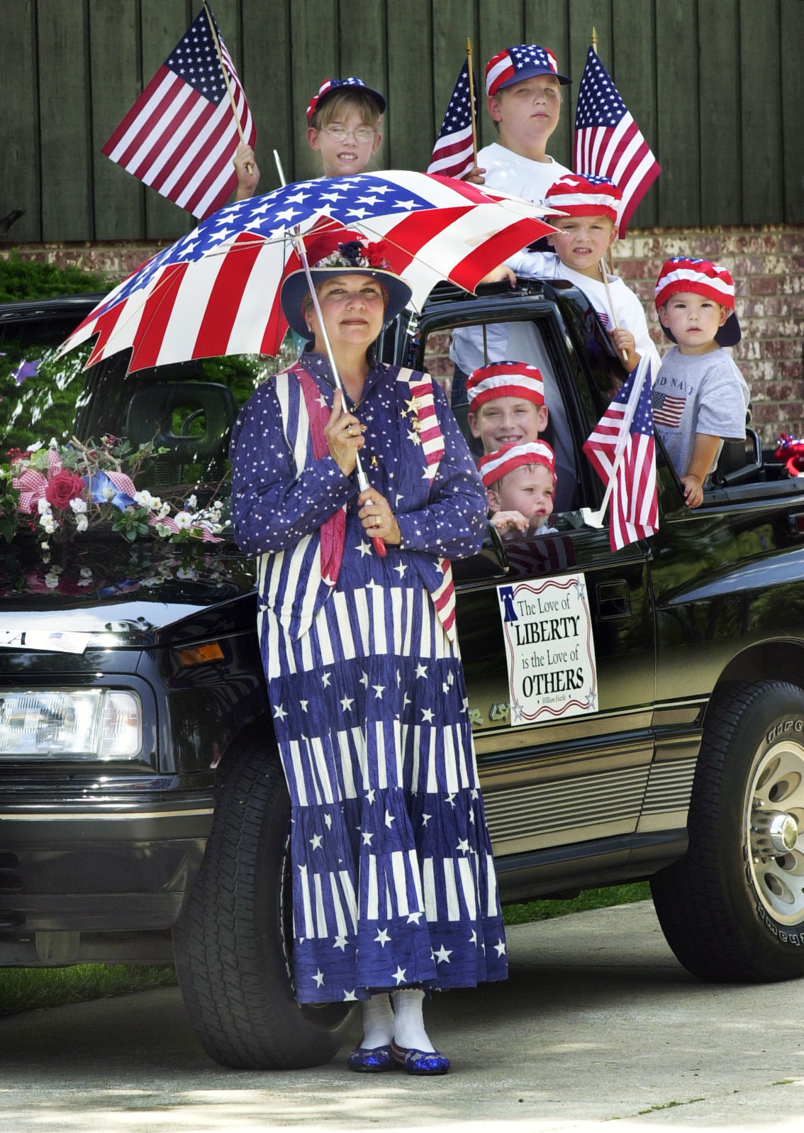 Grandparent, grandchildren ready for parade, 2001